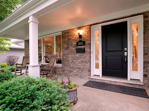 Lovely full front porch to sit and watch the neighborhood go by. Check out the new front door with f