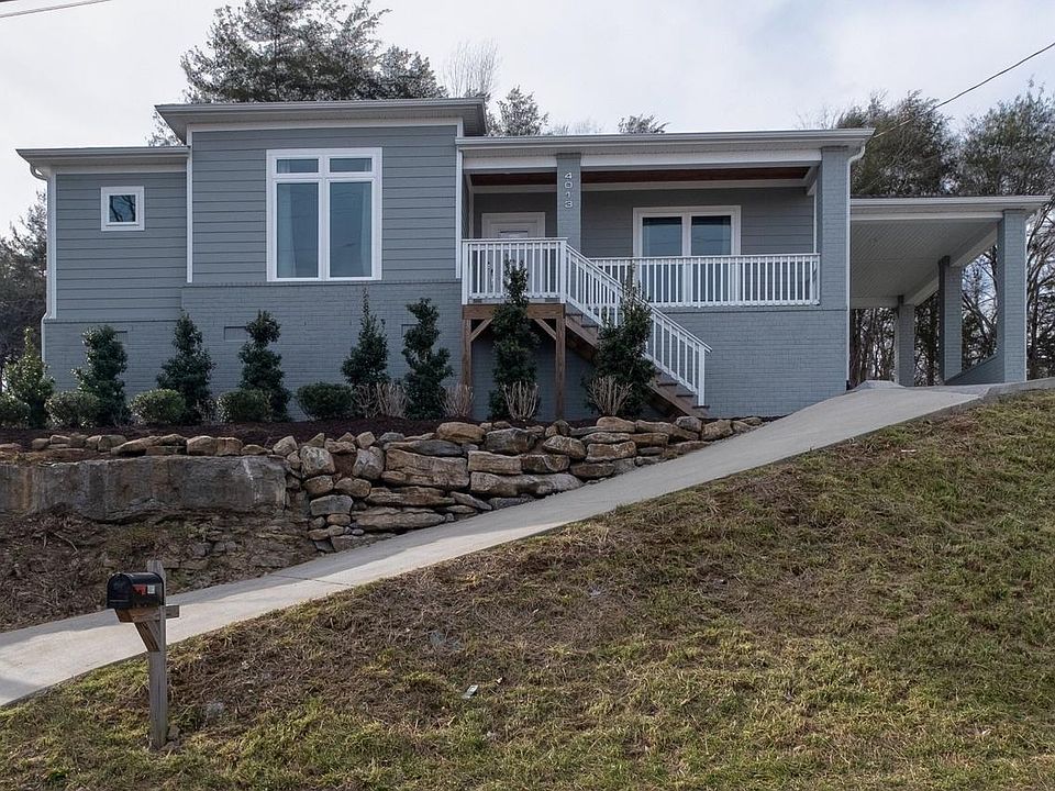 Welcome to your new home. Elevated curb appeal and ample privacy due to your elevation far above the neighborhood.