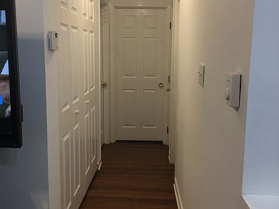 Hall with laundry on left
