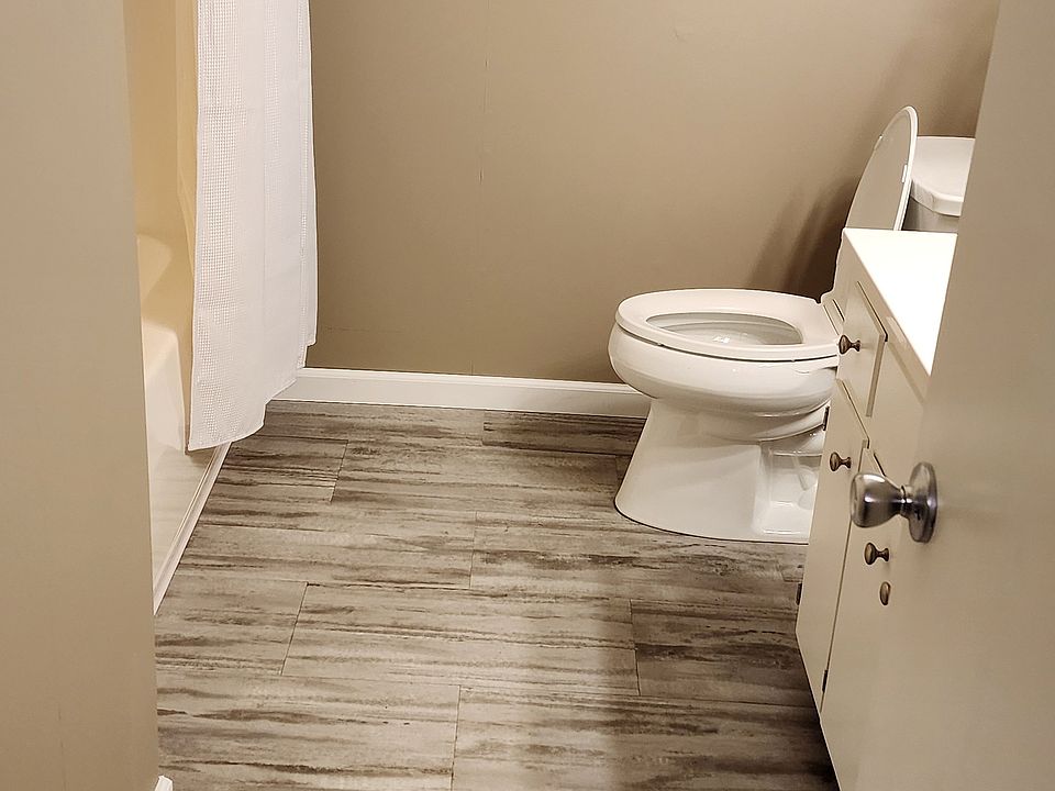 View of Main Bathroom - Full Tub and Shower Unit and modern vanity cultured marble.