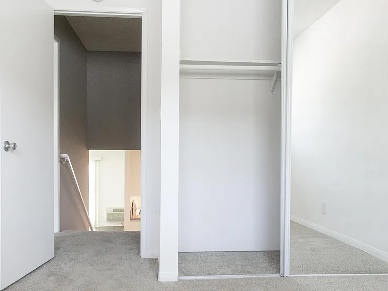 Split level secondary bedroom with standard closet and mirror doors.
--
*Floor plans are digital renderings. All dimensions are approximate. Actual product and specifications may vary in dimension or detail. Not all features are available in every apartme