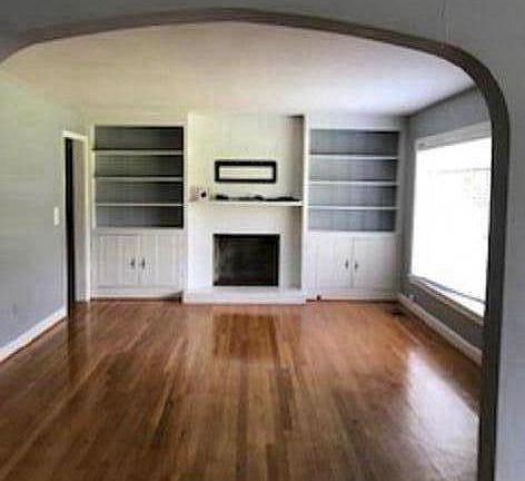 Living area with TV mount above fireplace