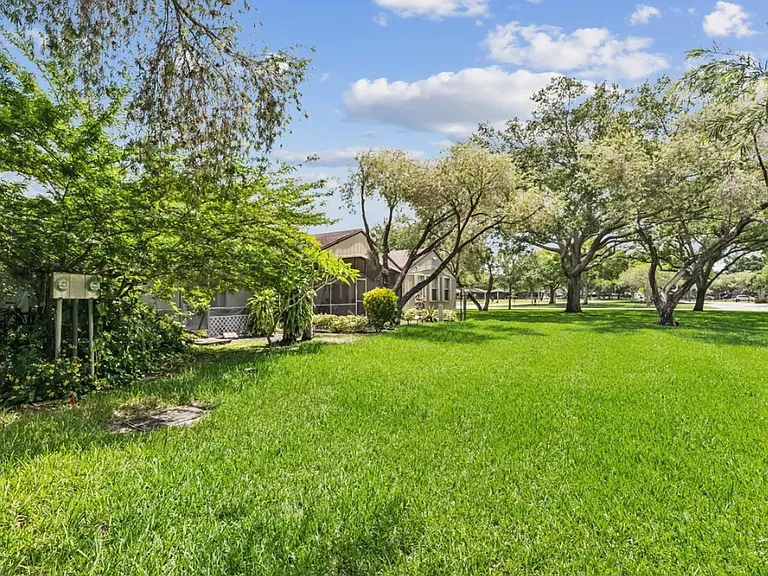 View from backyard. Pond with walking trail is close by.