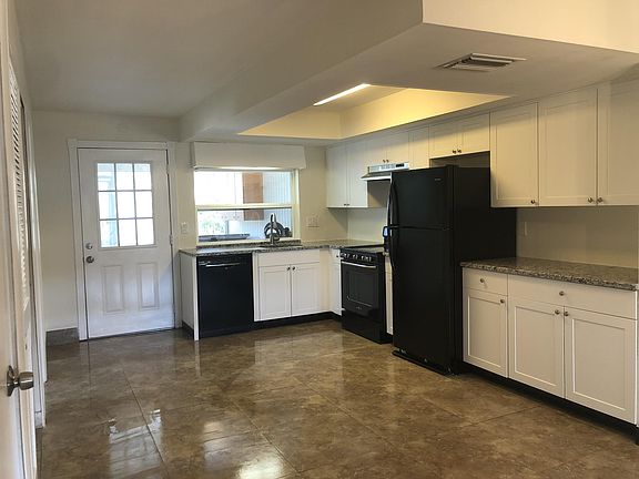 Brand new kitchen with beautiful white shaker cabinets, white ornamental granite stone, large floor tiles, newer dishwasher and fridge, upgraded stove.