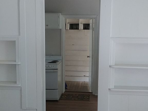 Main living space, facing kitchen and commonly used breezeway entrance (next to garage)