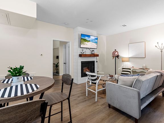 Fully furnished condo with couch, 55 inch TV, kitchen table, coffee table.