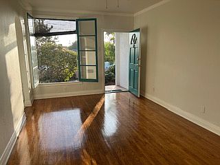 living room area with French windows that open up to the front garden