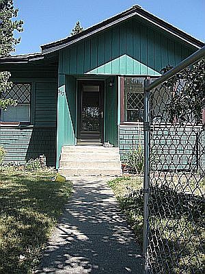Front of the house before the new paint job and removal of fence