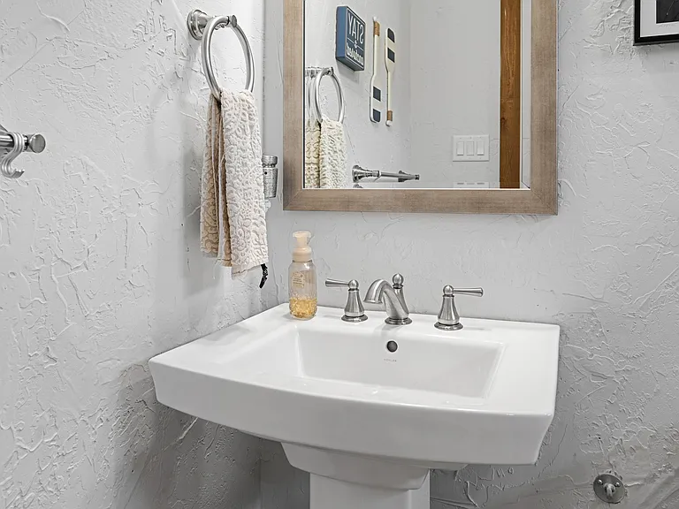 Bathroom #2 - walk-in shower, toilet and pedestal sink.