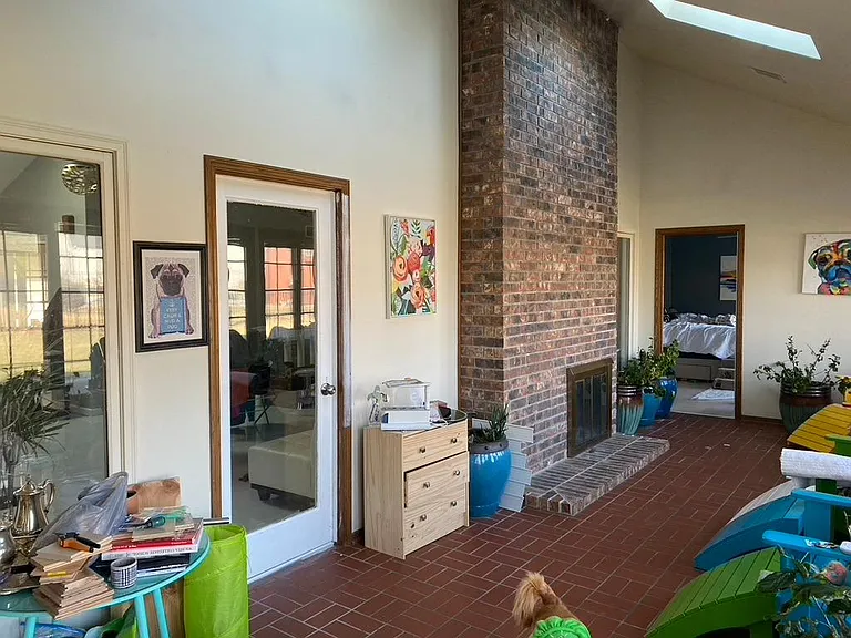 sun room, access off master bedroom, living room and family room- entry to the back yard