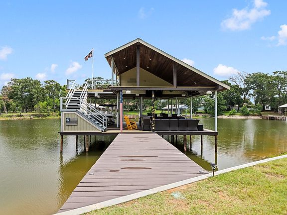Fabulous custom boathouse with approximately 11 feet of water depth at the end of the dock when lake is at full pool level.