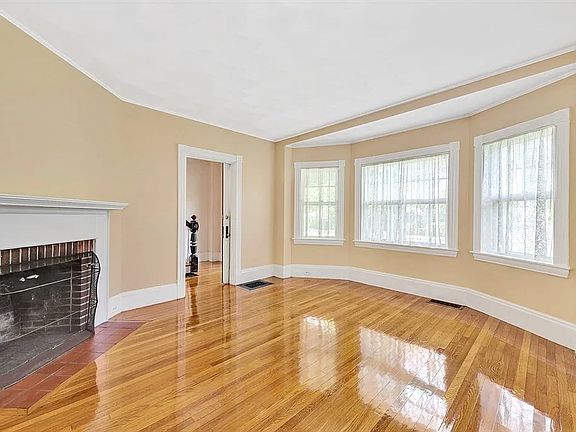 gleaming floors and open floor plan soaked in sun all day