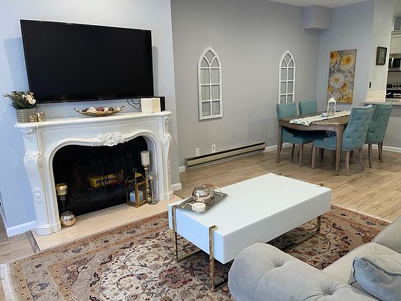 Living room with original fireplace and unique mantle