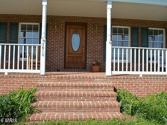 Enjoy your all brick front porch with views!