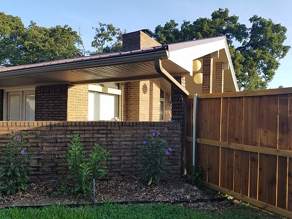 Leaf gutter guards & cedar fence
