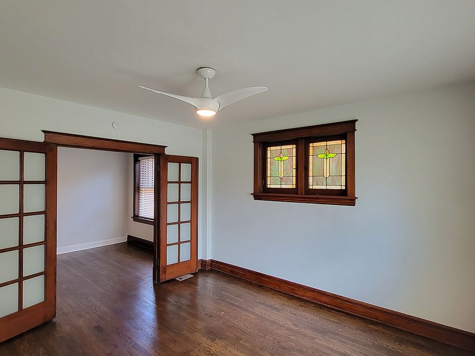 Bedroom 1 with Stained Class windows and French Doors... looking towards Living Room.