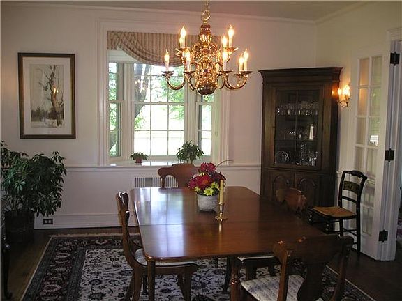 Dining Room with Original Sconces and French Doors