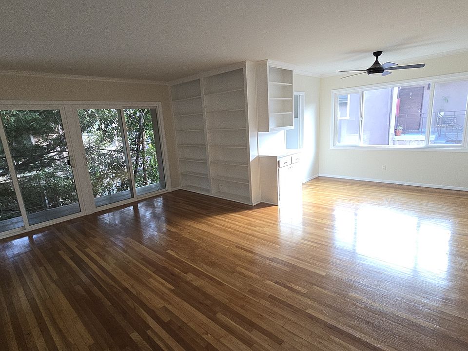 Living room and dining room area with lots of natural light