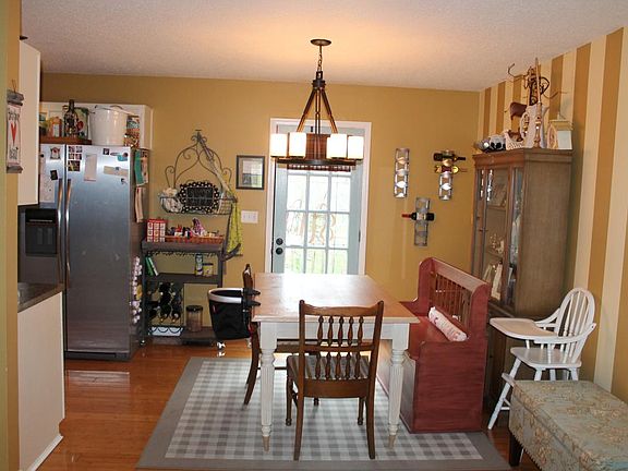 Eat in Kitchen/ Back door to porch overlooking stream