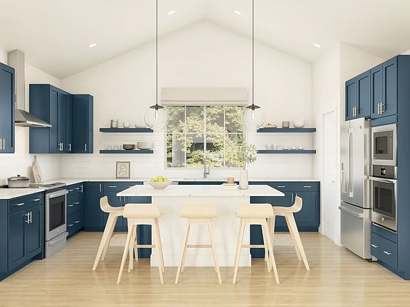 Kitchen with vaulted ceiling and pendant lighting