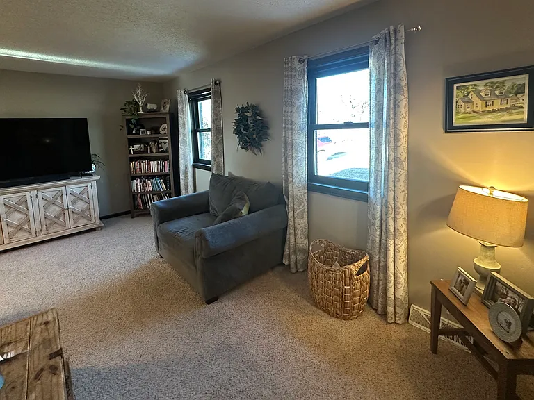 The spacious living room already offers plenty of room to relax and entertain, and the addition of the new windows has completely changed the feel of the space. Natural light now pours into the room, making it feel brighter.