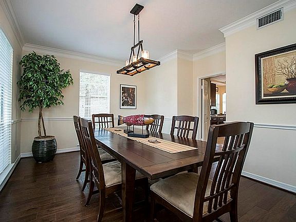 The dining has wood flooring, installed this year. It also features a chair rail and crown moldings. It s large size can accommodate large furniture as well.