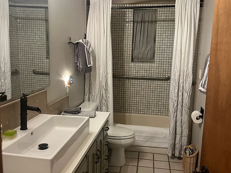 Entry level bathroom off hallway in between the two queen bedrooms