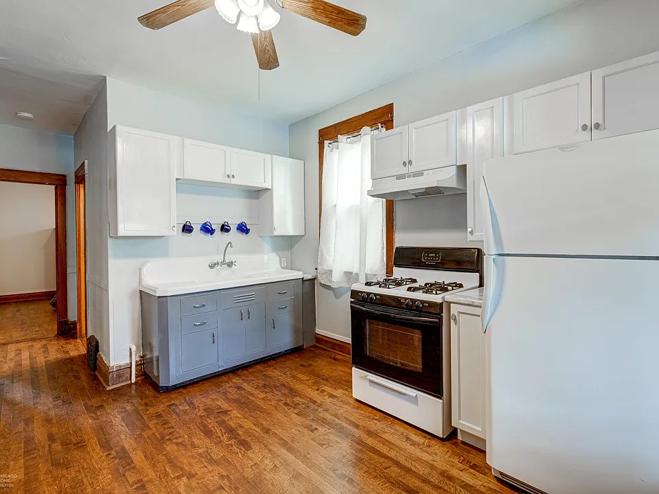 Restored vintage sink and new 36" cabinets. Apartment has same hardwood floors throughout