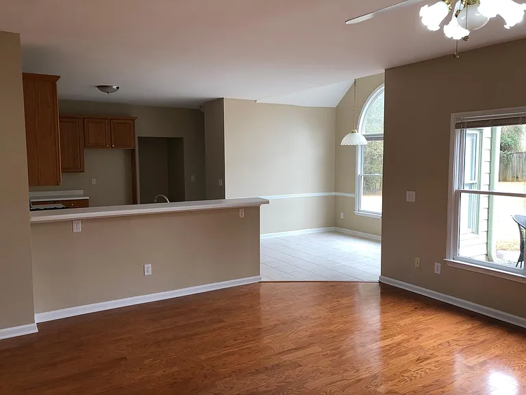 View of the kitchen and breakfast bar from the family room.