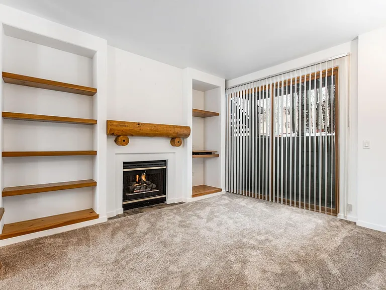 Living room with Gas Fireplace and patio