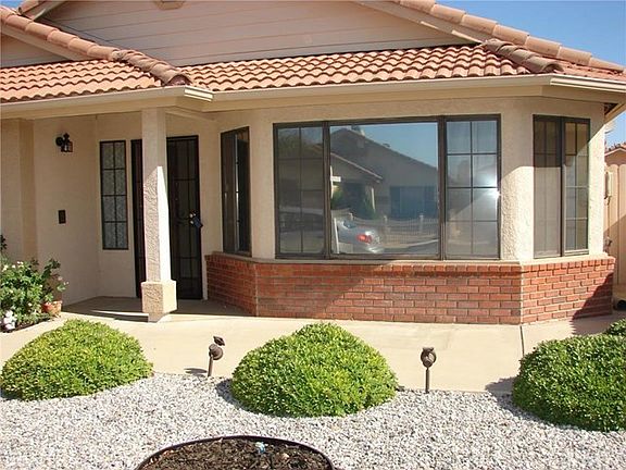 SELLERS ADDED CONCRETE SITTING AREA ON FRONT OF HOME. DUAL PANE WINDOWS THRU OUT THE HOME. FRONT BANK OF WINDOWS OPENS TO LIVING ROOM. LOW MAINTENANCE YARD...PERFECT FOR RETIREMENT!