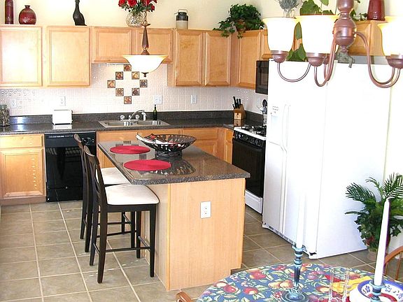Beautiful Kitchen with Double Sink and Custom Tile Backsplash and Floor