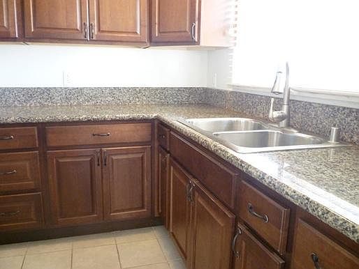 Bright kitchen with granite countertops