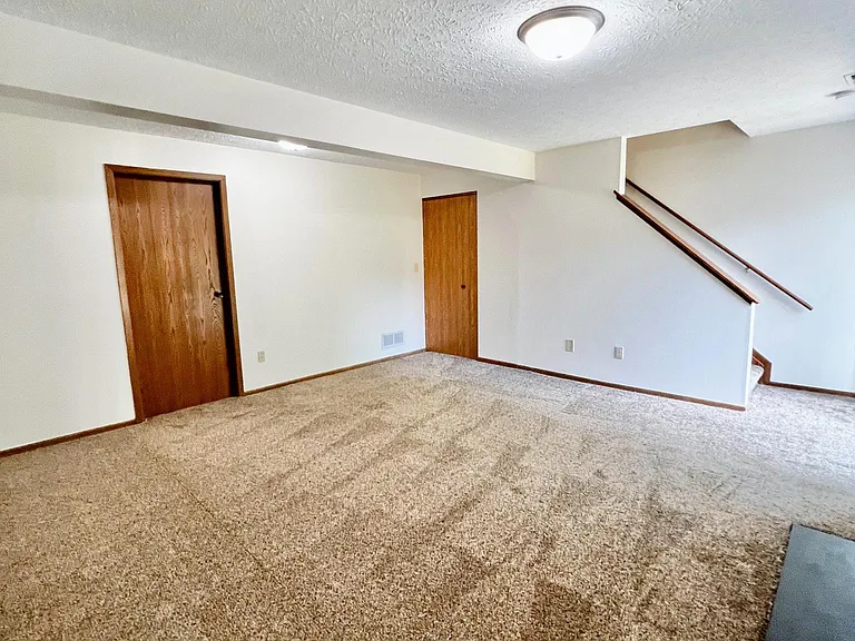 Lower level, with nice size closet under stairs. 2nd door is to laundry room/ storage room.