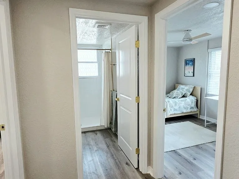Hall between 2 bedrooms and shared bathroom