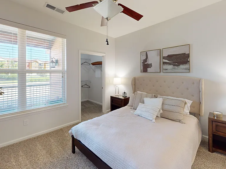 Your bedroom is a cozy place, complete with ample light and space.
