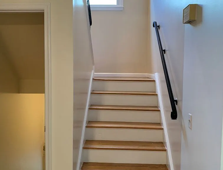 going Upstairs from 1st Floor Dinning Room Area (also doors on left is going down to basement)