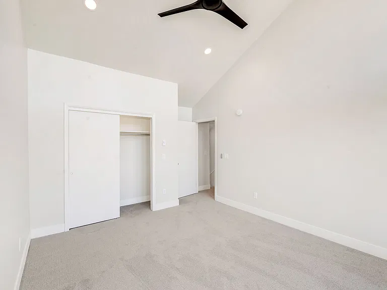 Bedroom #3 - on upper level. Floor to ceiling windows with electric black out window shades.