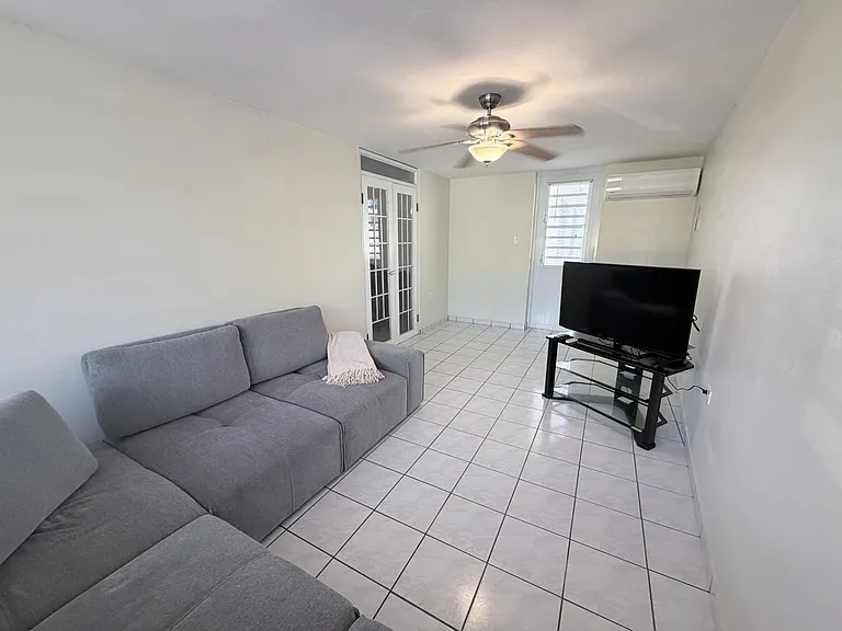 Family Room + New Air Conditioner + Exit to the Patio