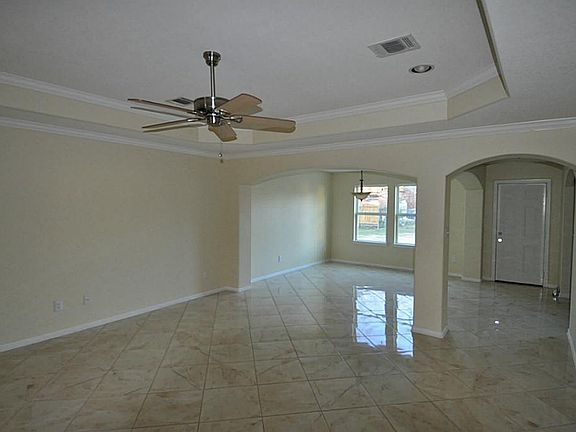 17 x16 Living Room with High ceilings, reset lighting, ceramic tile flooring.
