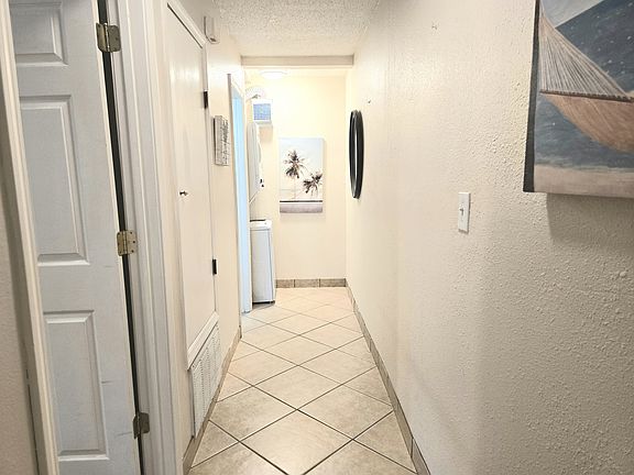 Hall to your private bedroom, bathroom, & laundry.