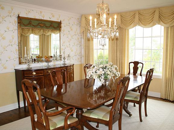 Formal dining room with bow window.