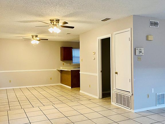 Living Room/Dining Room. 1/2 Bathroom on the right.