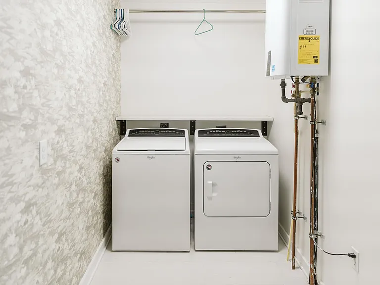 Laundry Room off the kitchen with instant hot water heater