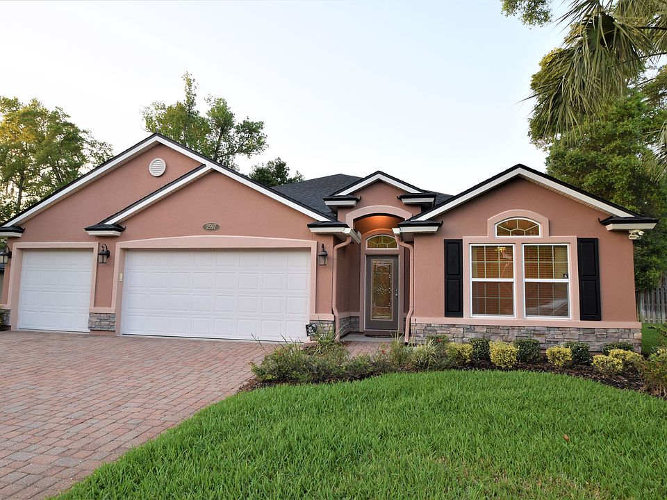 Exterior with 3 car garage. 