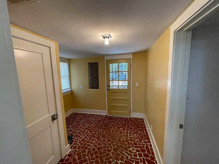 Mud room off the kitchen leads to backyard