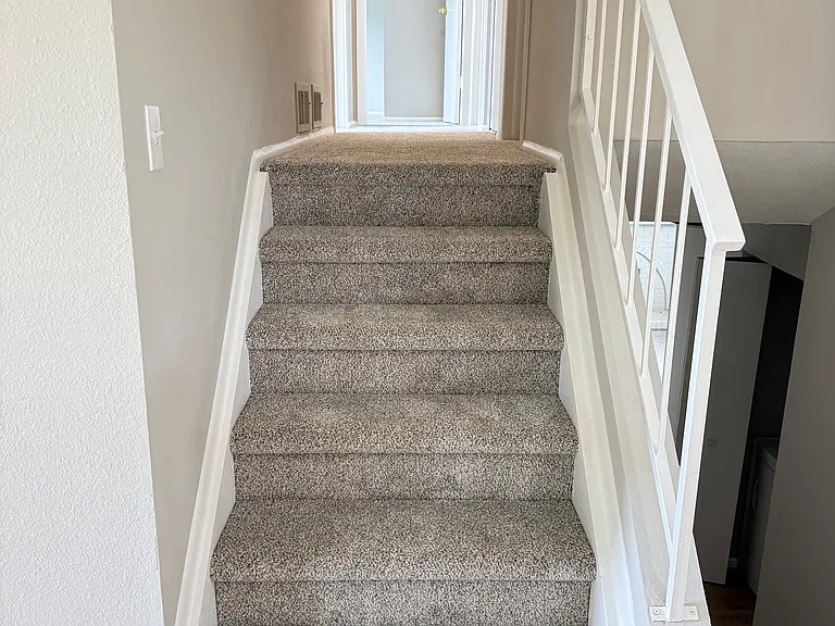 Upper stairs to 3 bedrooms