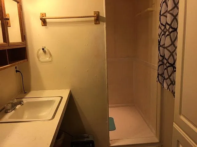 THE SHOWER OPENING TO A CUSTOM MADE SHOWER THAT IS FIVE FT. LONG AND FOUR FEET WIDE. "SHOWER WITH A FRIEND, AND SAVE WATER" !