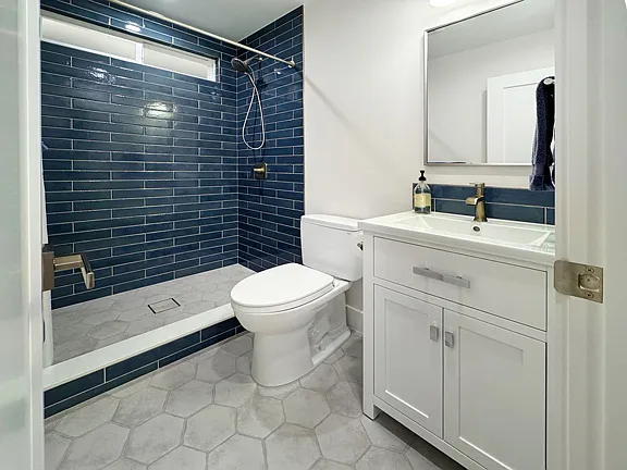 Brand new designer bathroom with custom tile