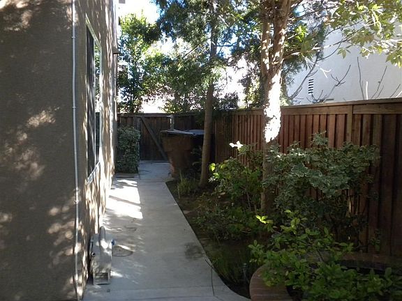 East side yard with door to garage